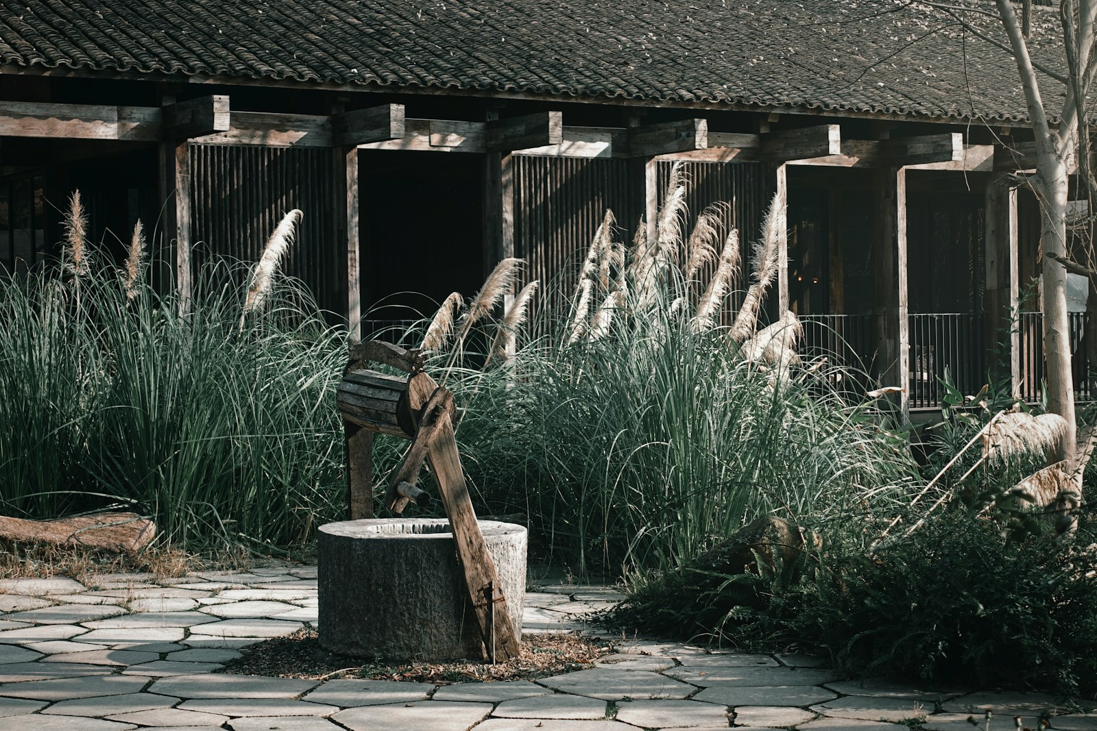 a wooden bench sitting in front of a building
